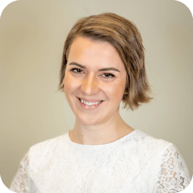 Alex smiling for a professional picture