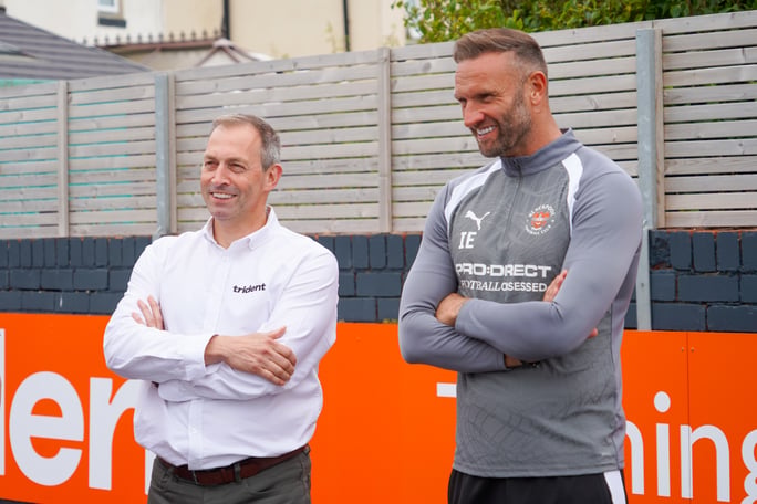 Michael Dugdale stood with Ian Evatt, Head Coach at Blackpool FC